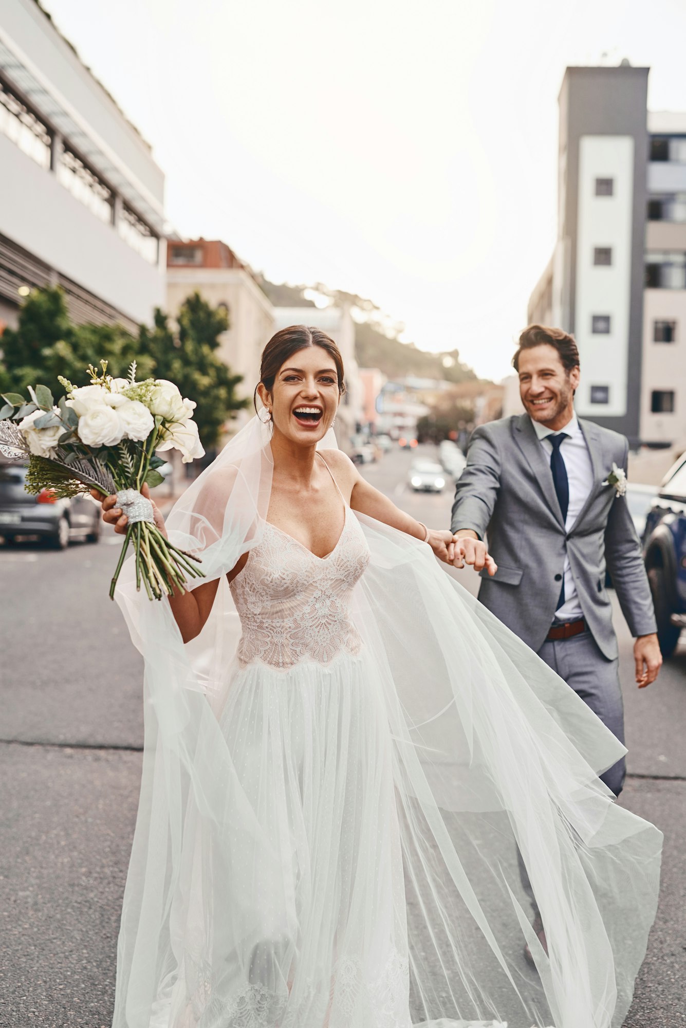 Shot of a beautiful couple out in the city on their wedding day